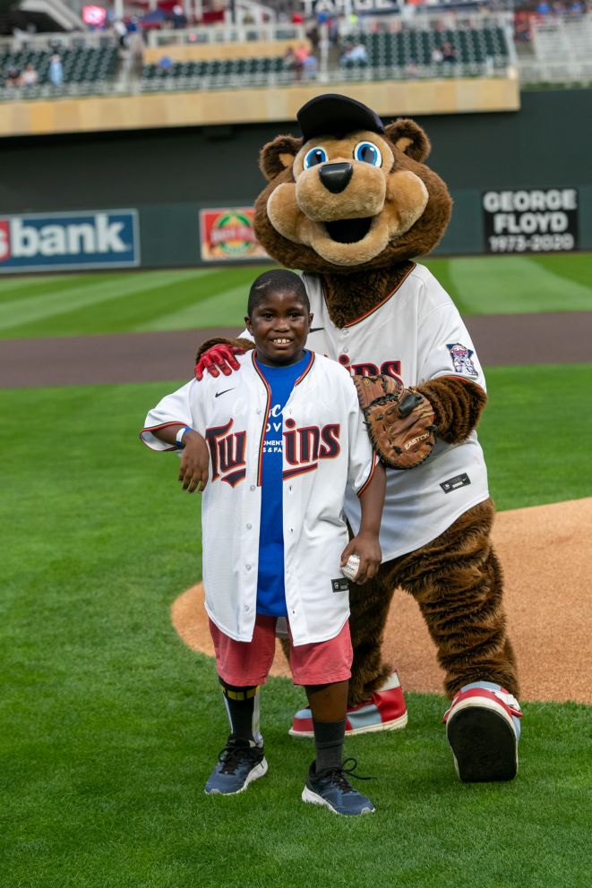 Crescent Cove kid Ezekiel throws out the first pitch at the 2021 Crescent Cove Day at the Minnesota Twins. 